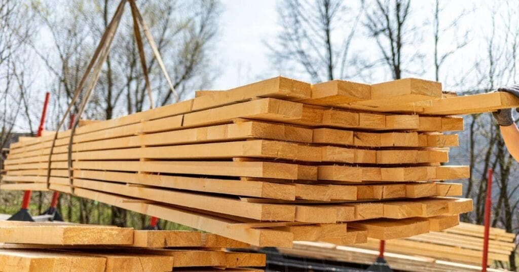 Bundle of framing timber being lifted on a building site, ready for the spring building season